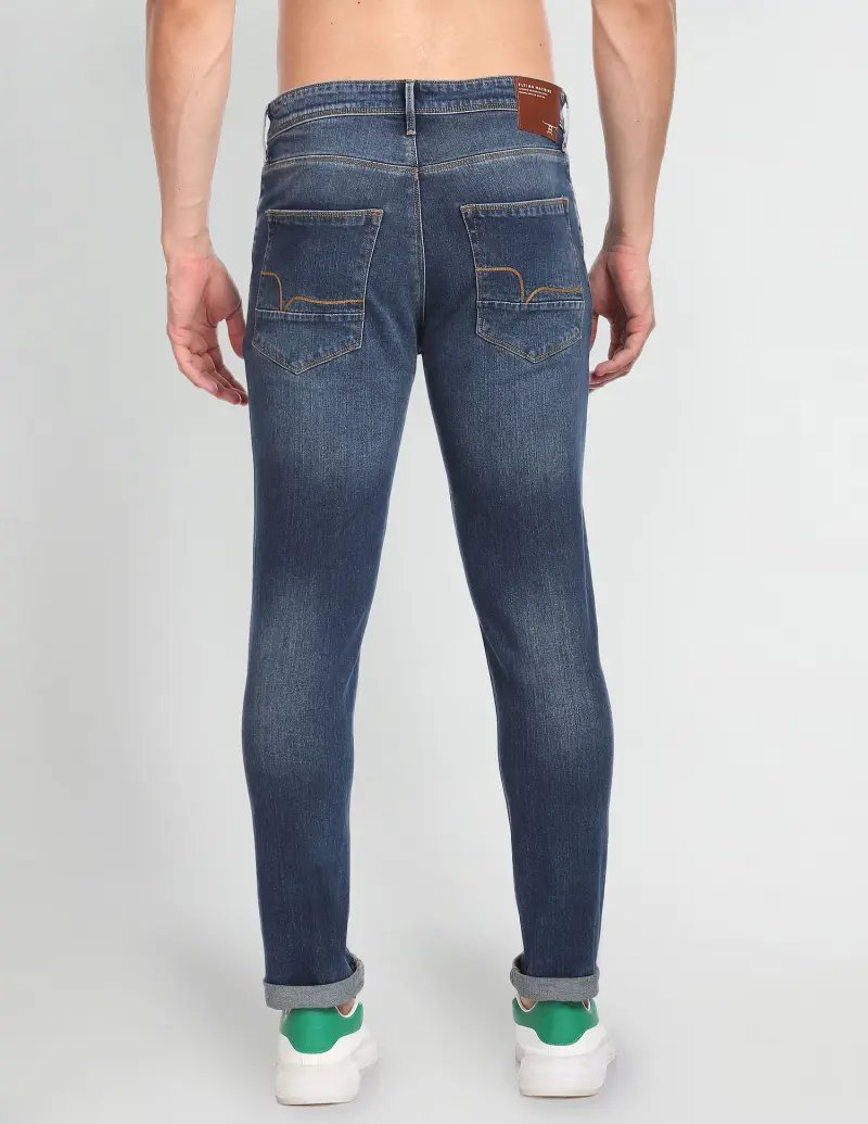 Mid Rise Stone Wash Distressed Jeans