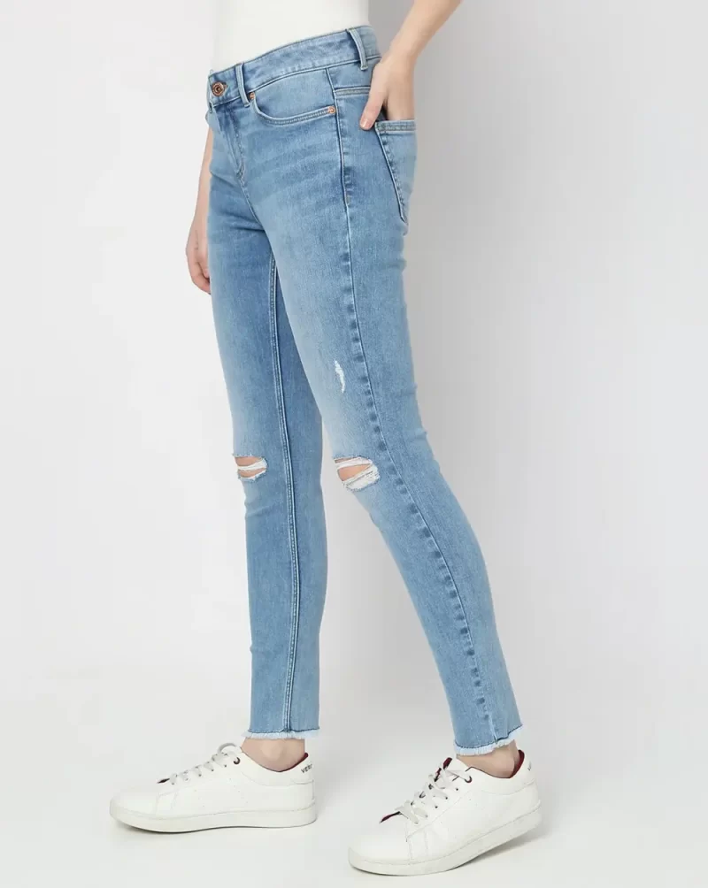 LIGHT BLUE MID RISE DISTRESSED SKINNY JEANS
