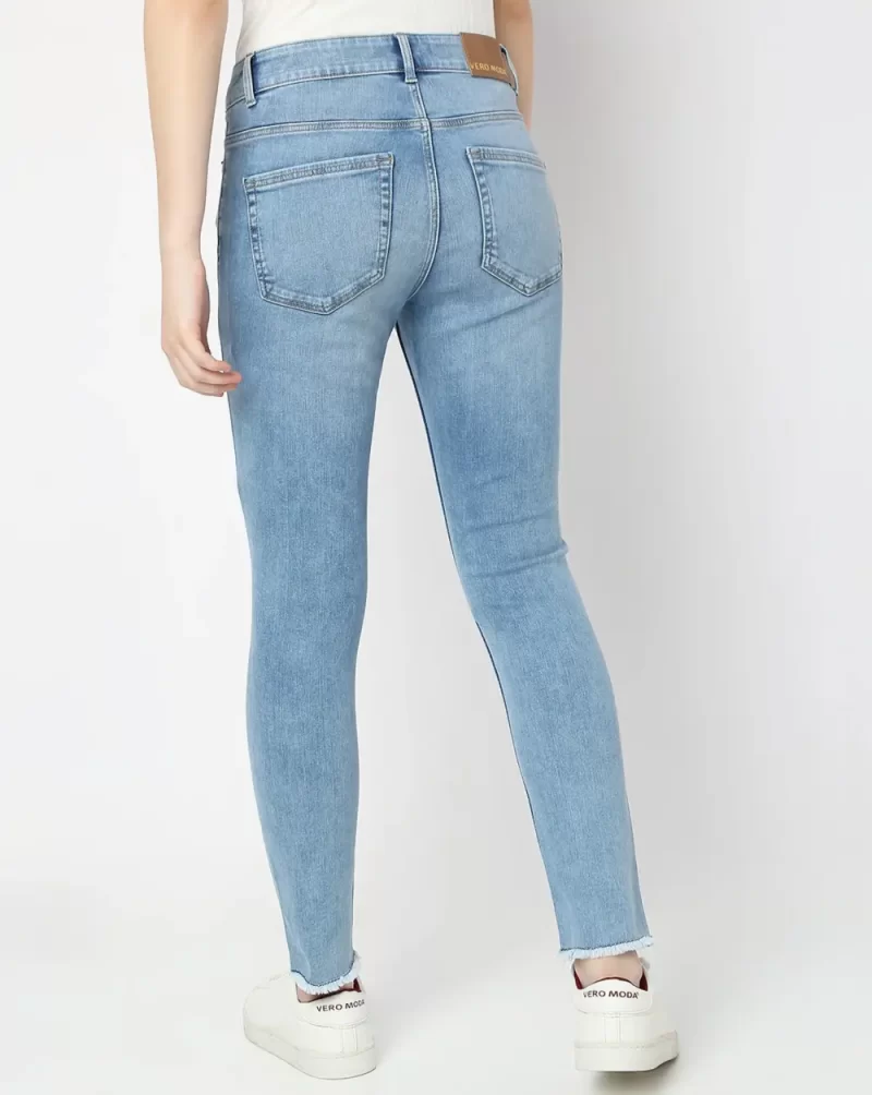 LIGHT BLUE MID RISE DISTRESSED SKINNY JEANS