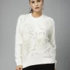 Apricot Solid Embroidered Top ,Has A Round Neck, Long Sleeves, Ribbed Hem