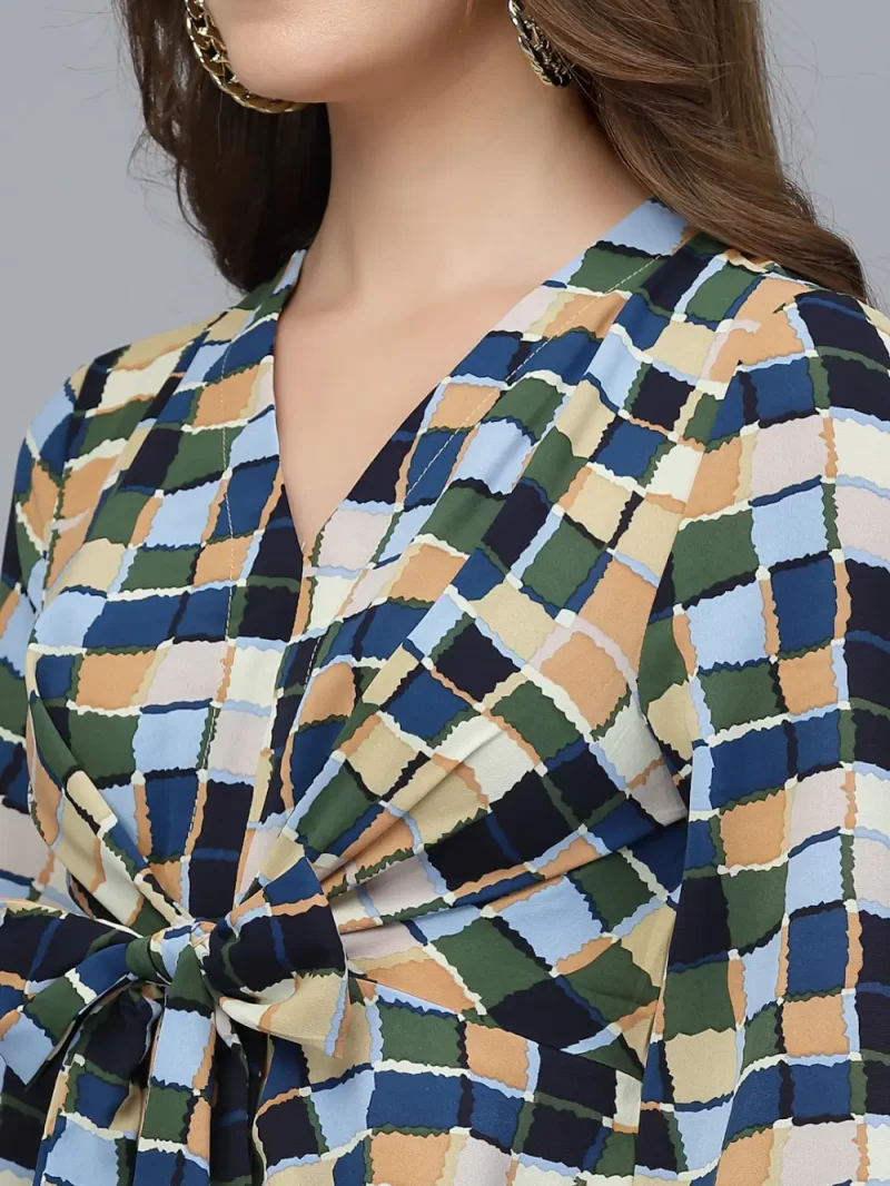 Printed Peplum Style Top With Front Tie And V-Neck